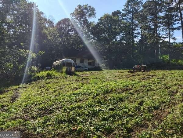 Rare 9.5-Acre Haven with Spring-Fed Pond, Multiple Structures &amp; - photo 31