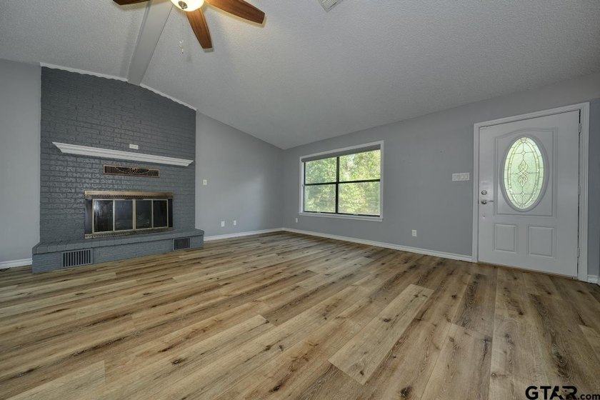 Nestled on a quiet street, this inviting residence blends - photo 3