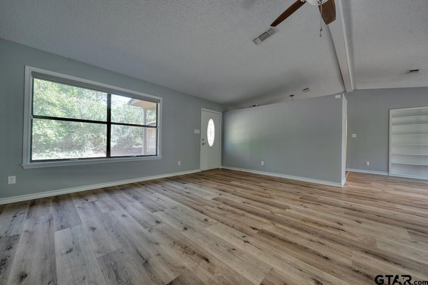 Nestled on a quiet street, this inviting residence blends - photo 5