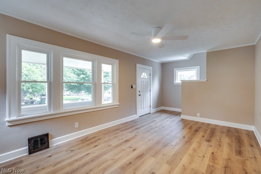 Move-in ready with extensive updates! New windows, flooring - photo 3