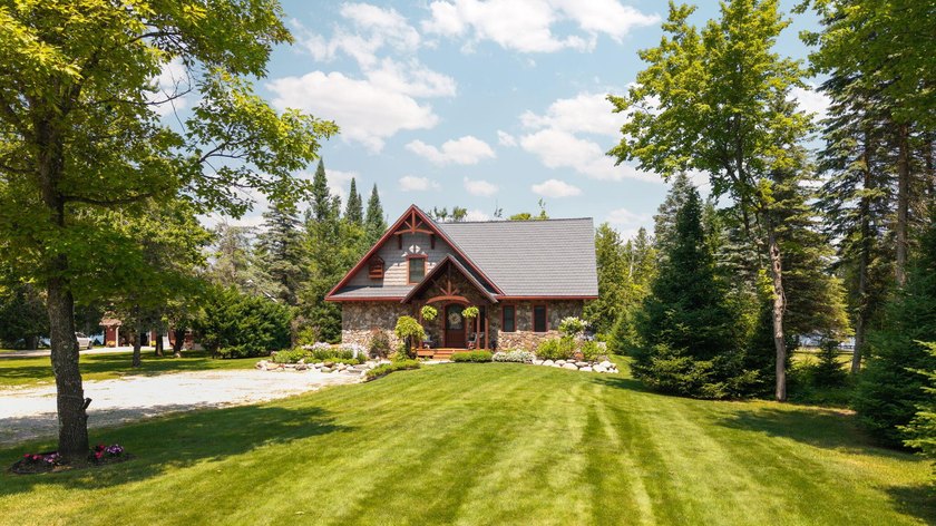 Experience exceptional lakefront living with 100 feet of - photo 12