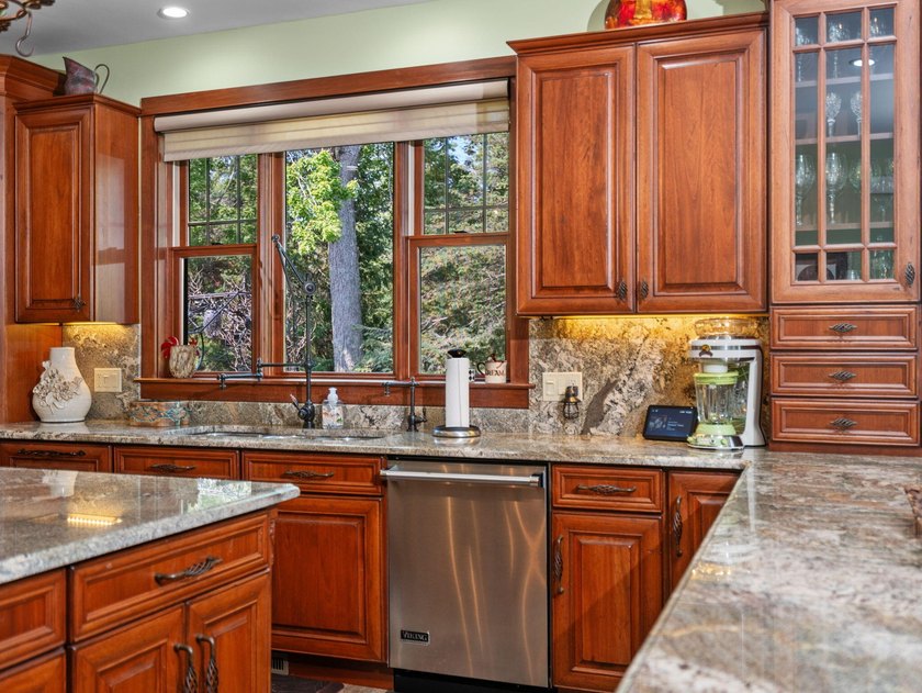 Experience exceptional lakefront living with 100 feet of - photo 20