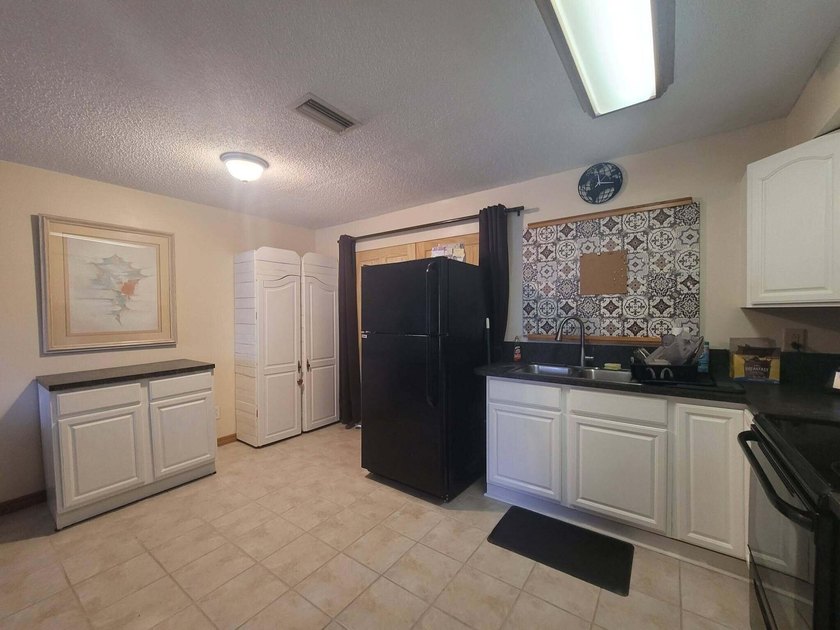 Welcome to this charming concrete block home in desirable - photo 13