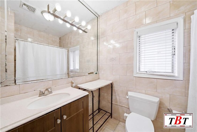 Welcome to 1855 east 13th street. A beautiful 2 family home in - photo 18
