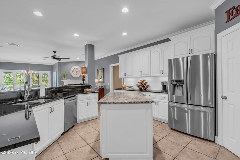 Nestled on approximately 1.5 beautifully landscaped acres in the - photo 12