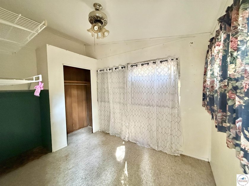 Discover the potential of this quaint two-bedroom cabin, nestled - photo 19
