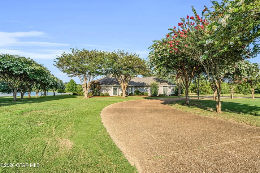 Nestled on approximately 1.5 beautifully landscaped acres in the - photo 38