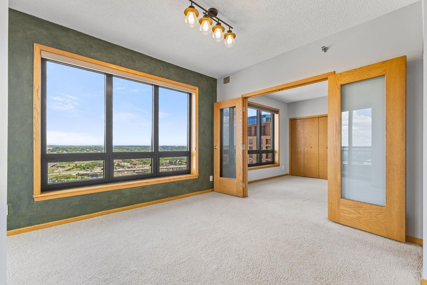 Set high on the 29th floor of Airye Tower, this corner-unit - photo 9