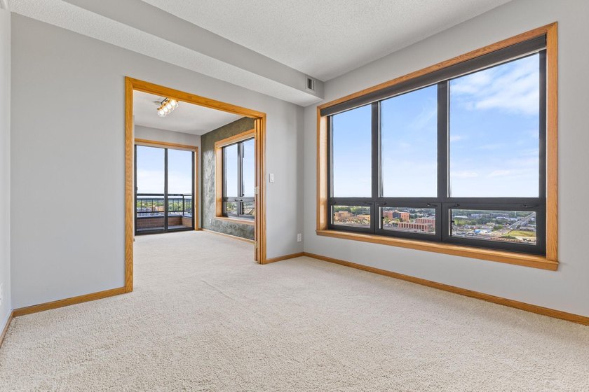 Set high on the 29th floor of Airye Tower, this corner-unit - photo 10