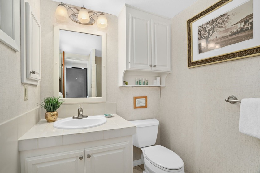 Welcome to Unit M4 - a top-floor, corner 2-bedroom, 1.5-bath - photo 8