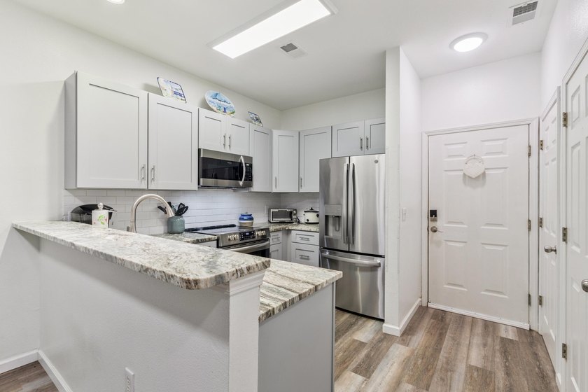 Discover this beautifully renovated first-floor end-unit condo - photo 3