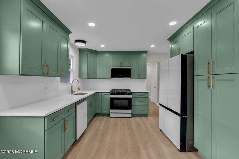 Welcome home to this beautifully remodeled ranch where modern - photo 11