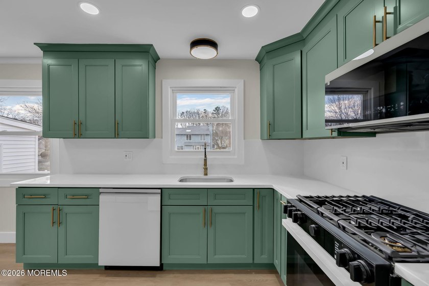 Welcome home to this beautifully remodeled ranch where modern - photo 13