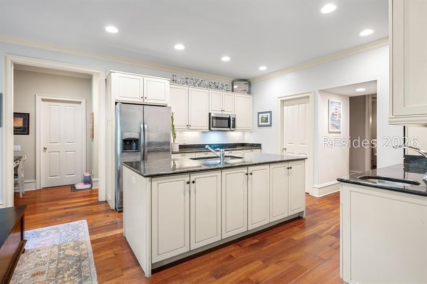 Welcome to 3 Wood Duck Court, a gracious island residence tucked - photo 25