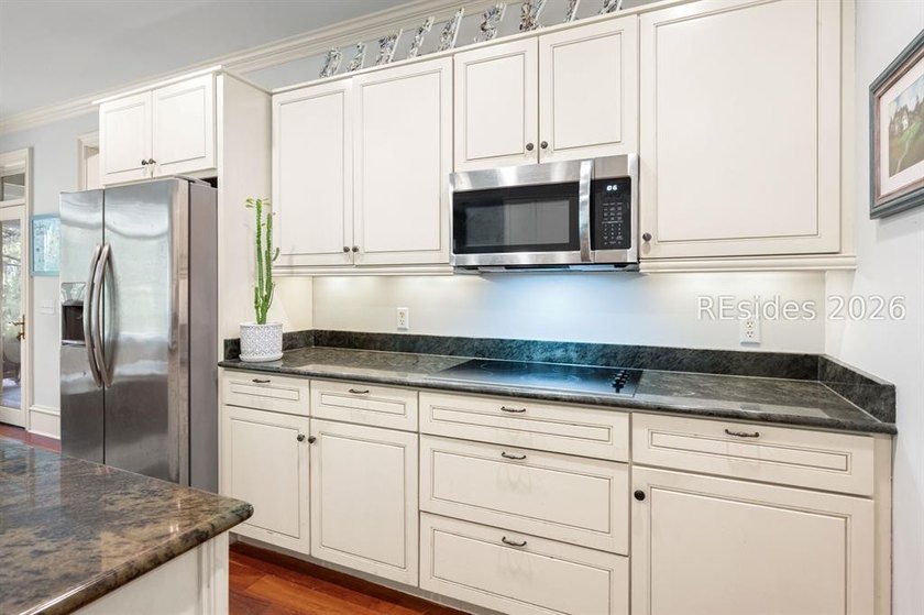 Welcome to 3 Wood Duck Court, a gracious island residence tucked - photo 30