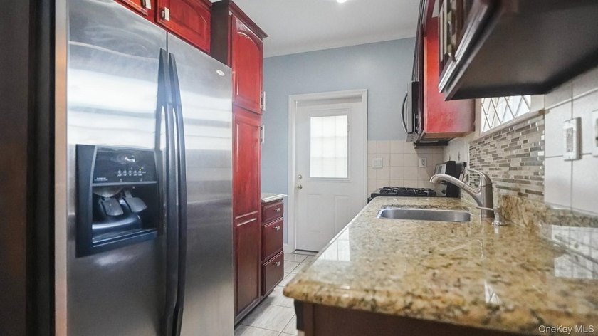 Welcome to this beautifully maintained two-family home in the - photo 5