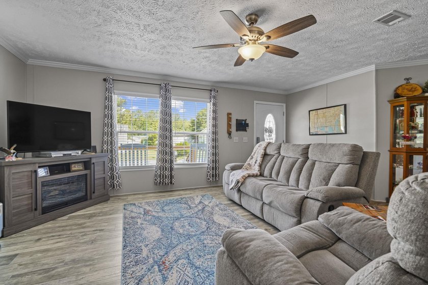 Three-bedroom, two-bathroom, single-story manufactured home with - photo 2