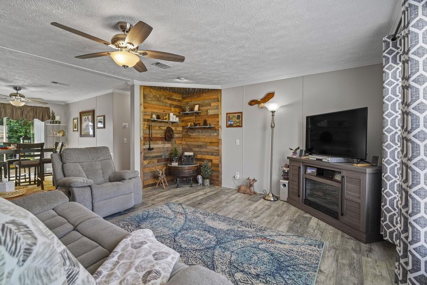 Three-bedroom, two-bathroom, single-story manufactured home with - photo 4