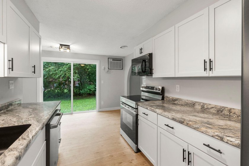 A fresh approach to one-level living! This zero-entry home sits - photo 9