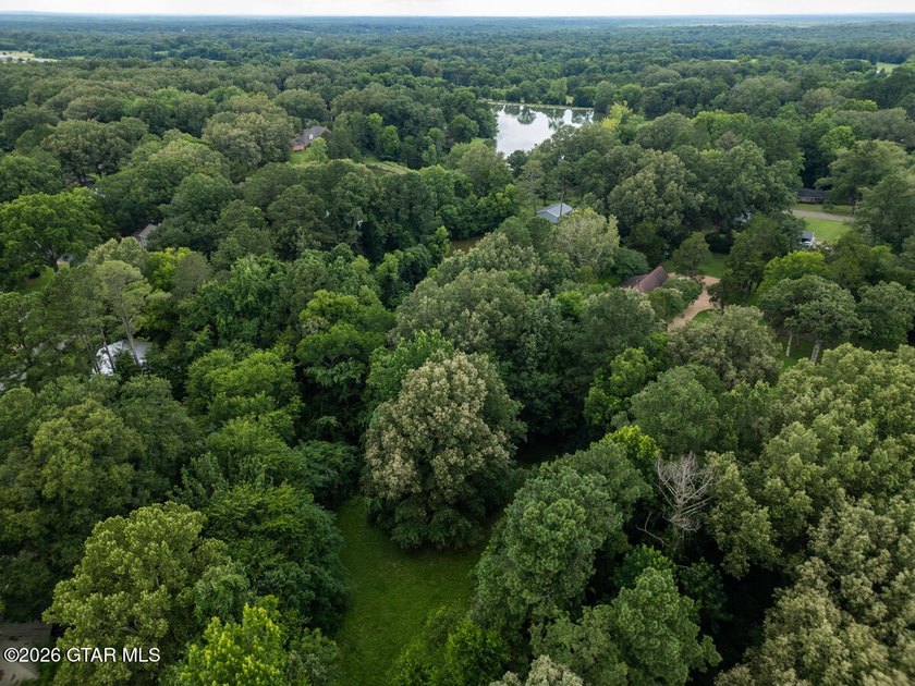 Set on 4.04 acres with pond frontage, this custom-built - photo 11