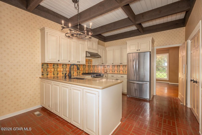 Set on 4.04 acres with pond frontage, this custom-built - photo 18
