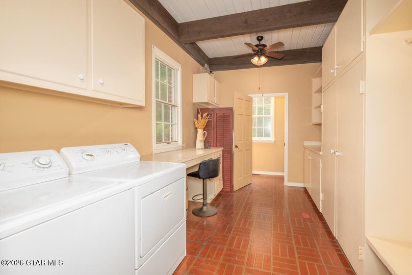 Set on 4.04 acres with pond frontage, this custom-built - photo 20