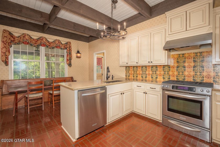 Set on 4.04 acres with pond frontage, this custom-built - photo 22