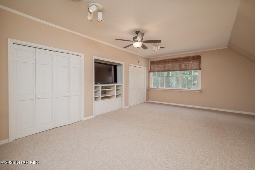Set on 4.04 acres with pond frontage, this custom-built - photo 27