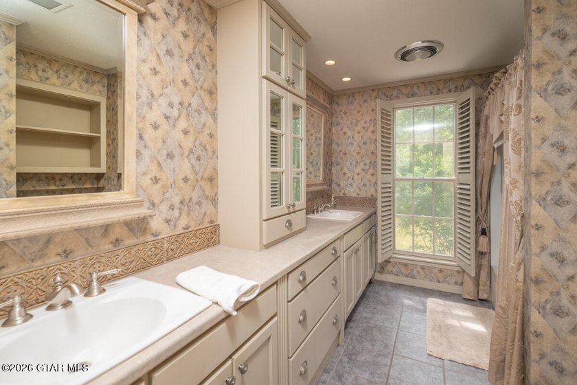 Set on 4.04 acres with pond frontage, this custom-built - photo 28