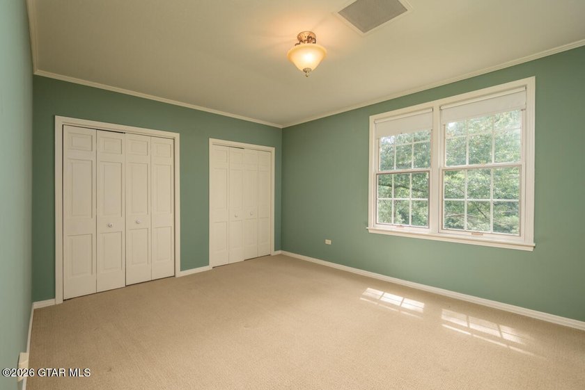 Set on 4.04 acres with pond frontage, this custom-built - photo 29