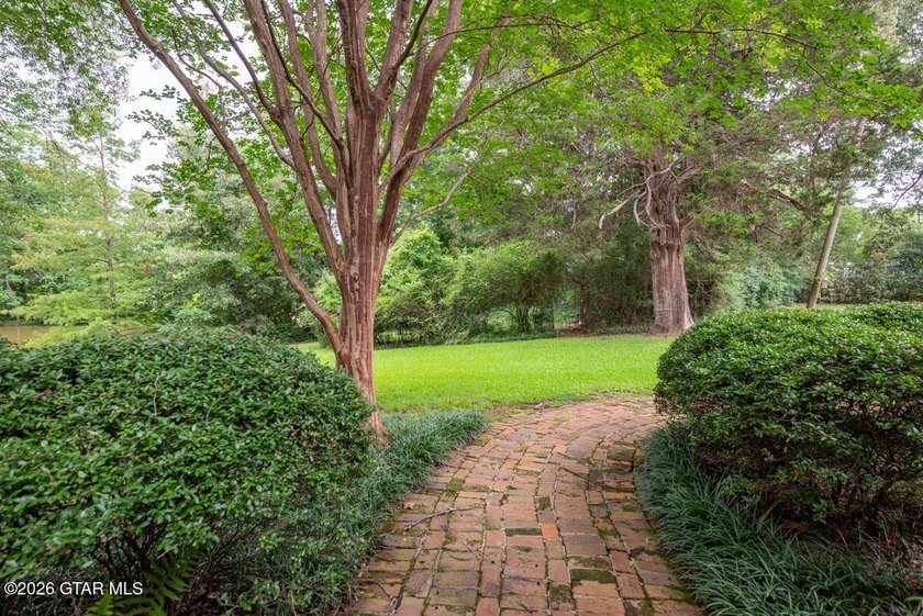 Set on 4.04 acres with pond frontage, this custom-built - photo 45