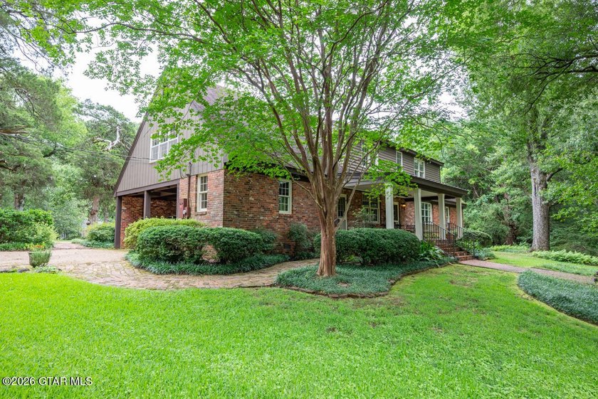 Set on 4.04 acres with pond frontage, this custom-built - photo 46