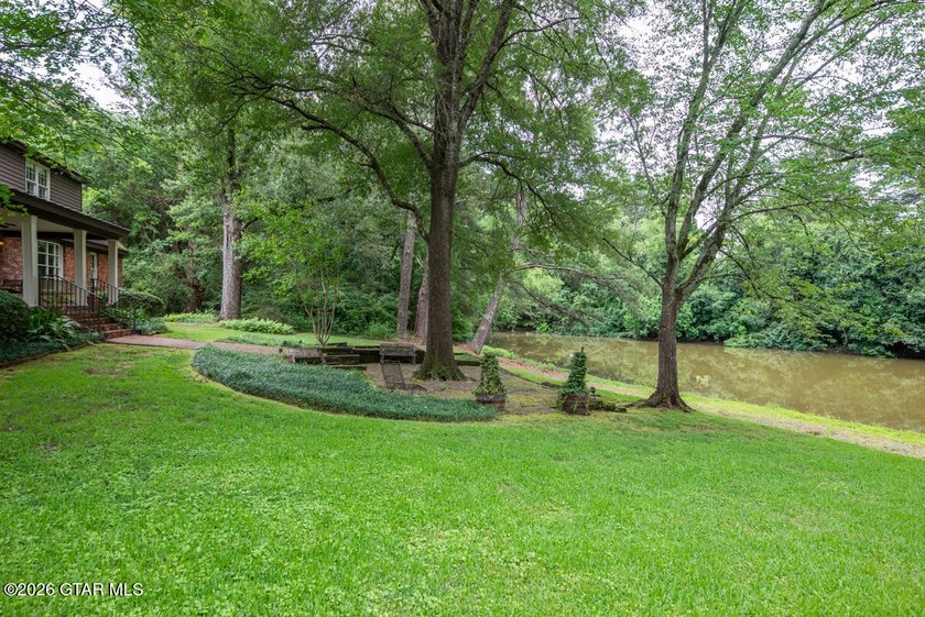 Set on 4.04 acres with pond frontage, this custom-built - photo 47