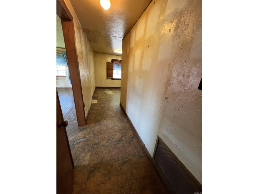 Lakefront fixer-upper with incredible potential! Prime location - photo 6