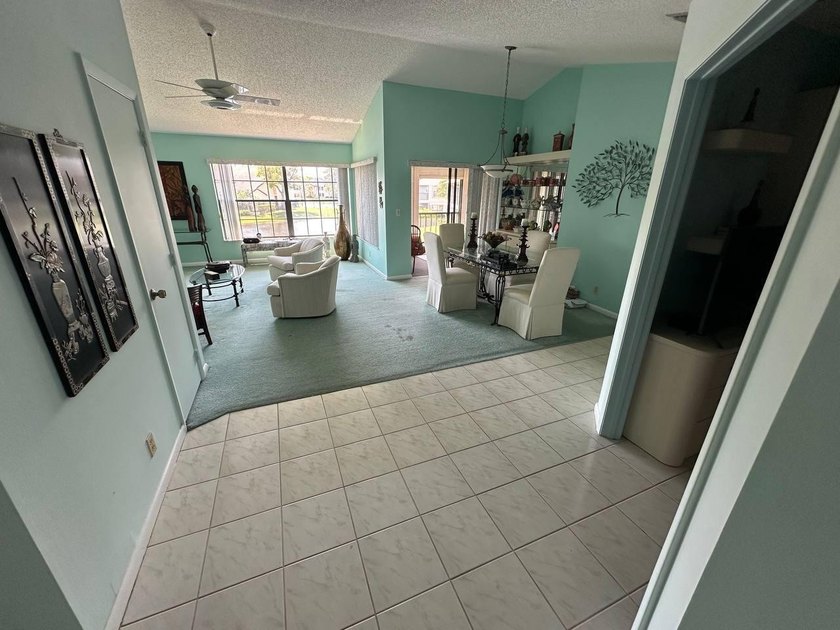 Discover this beautifully maintained condominium in the heart of - photo 3
