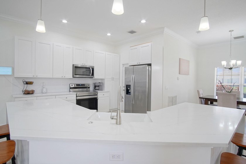 This stunning pool home has it all! Gorgeous plank tile flooring - photo 3