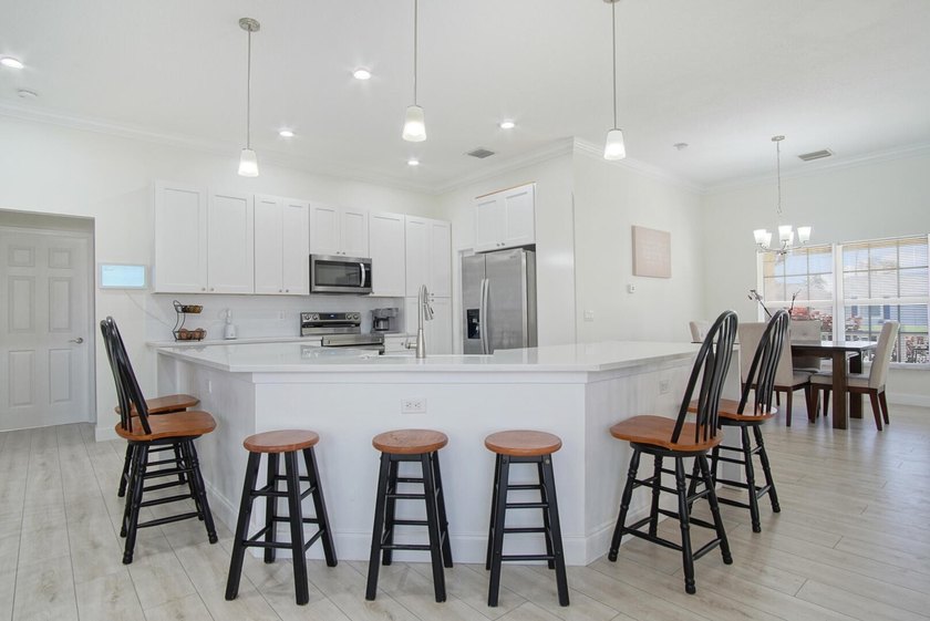 This stunning pool home has it all! Gorgeous plank tile flooring - photo 4