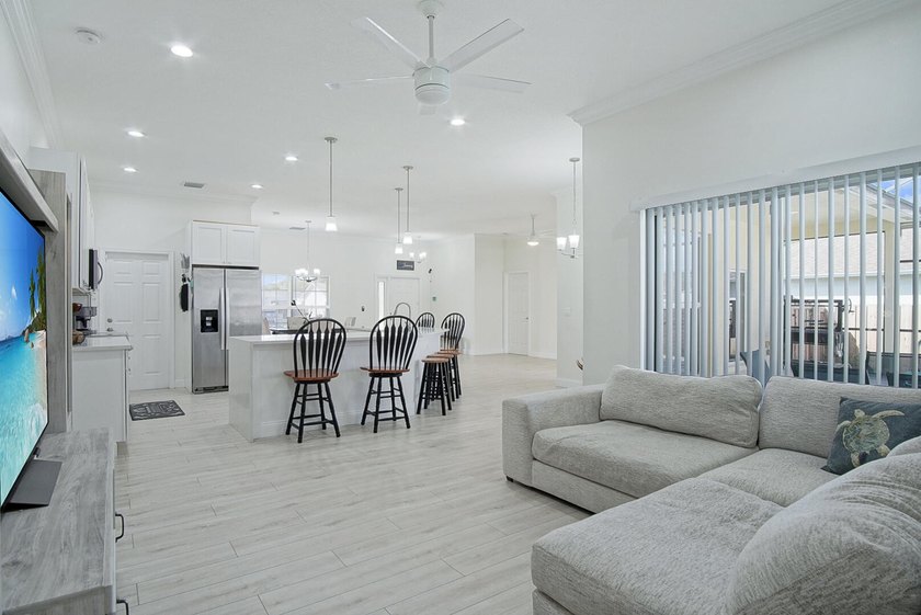 This stunning pool home has it all! Gorgeous plank tile flooring - photo 10