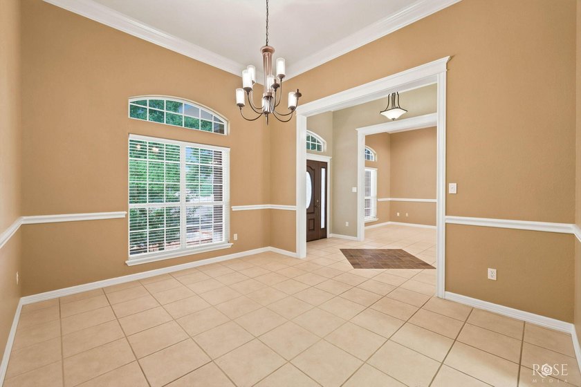This beautiful home offers spacious living with soaring ceilings - photo 18