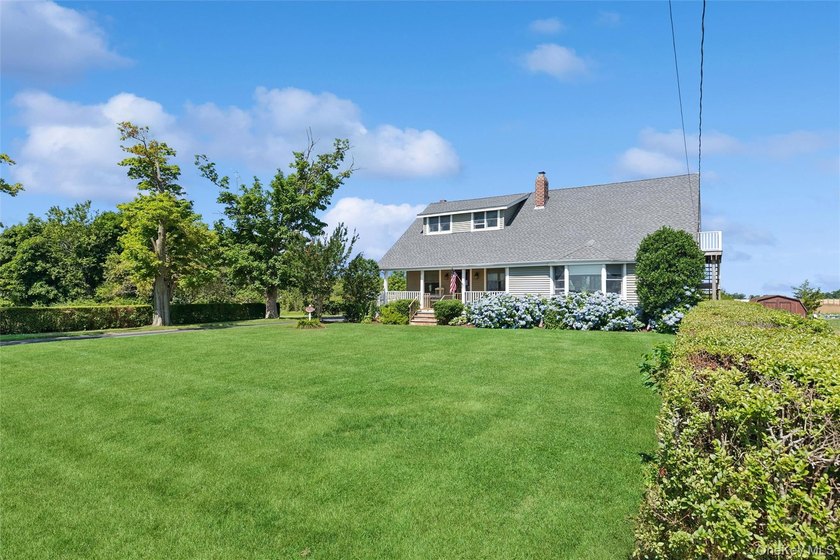 Nestled along picturesque Oregon Road, one of Cutchogue's most - photo 2