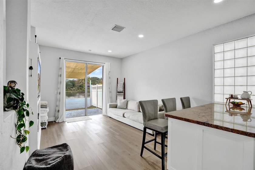 This beautifully updated 4BR/2.5BA waterfront home offers serene - photo 11