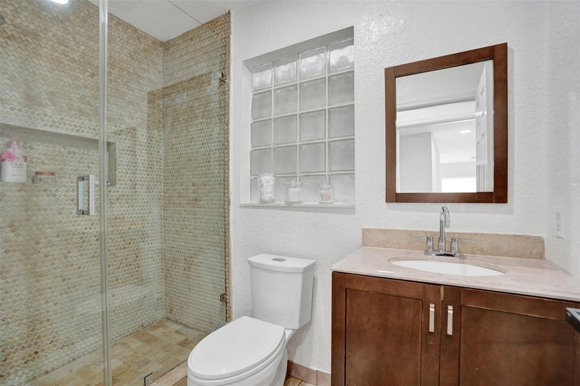 This beautifully updated 4BR/2.5BA waterfront home offers serene - photo 24