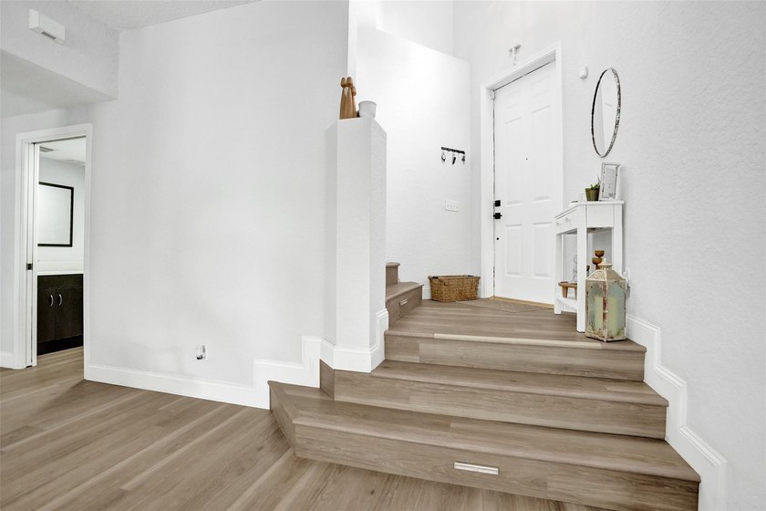 This beautifully updated 4BR/2.5BA waterfront home offers serene - photo 29