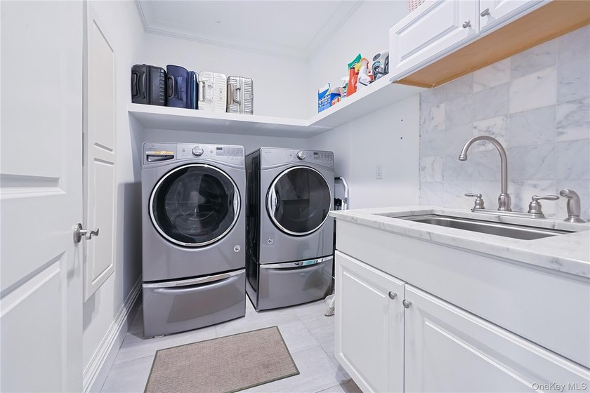 Located in the prestigious Village of Roslyn Harbor, this - photo 25