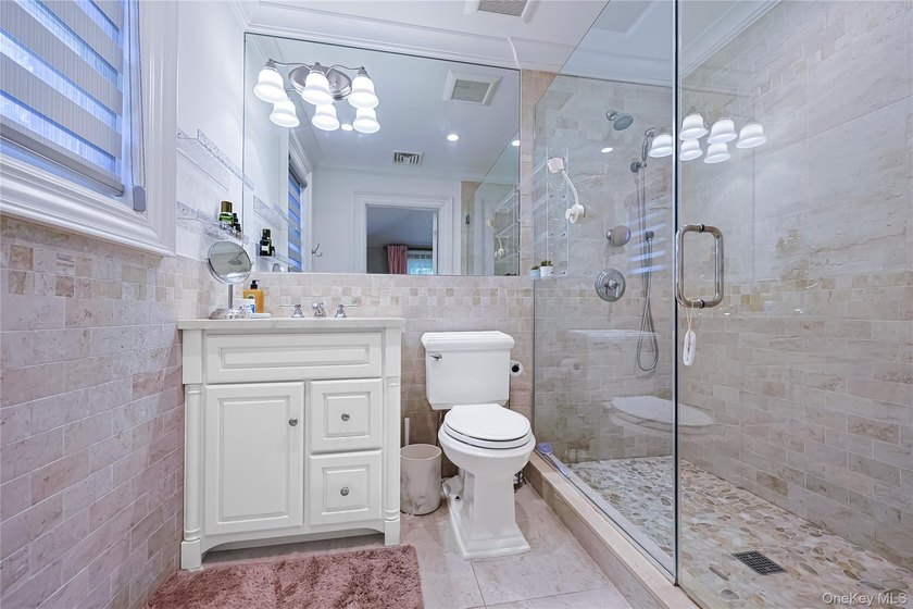 Located in the prestigious Village of Roslyn Harbor, this - photo 29