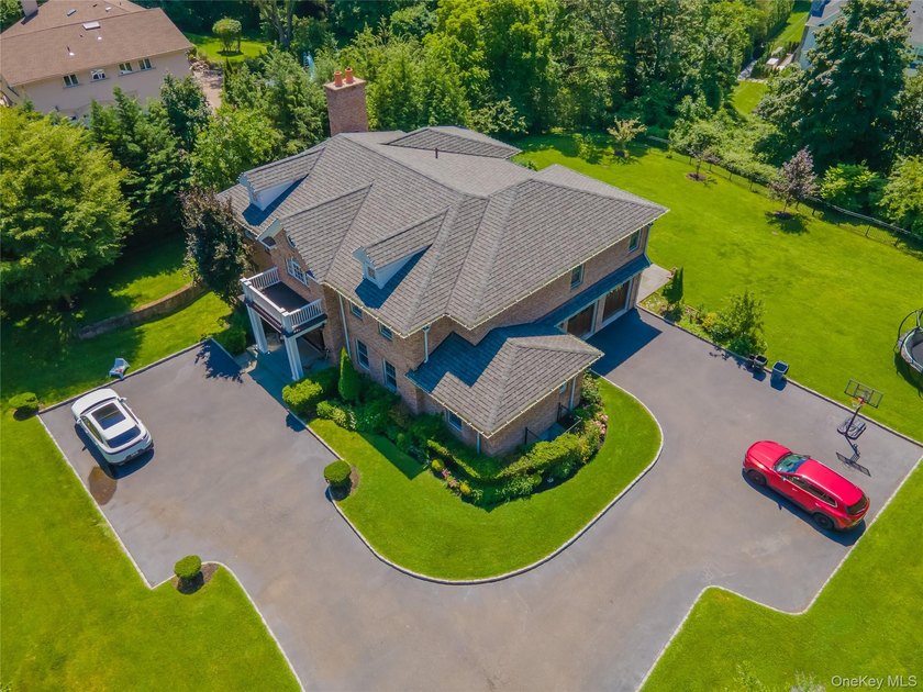 Located in the prestigious Village of Roslyn Harbor, this - photo 45