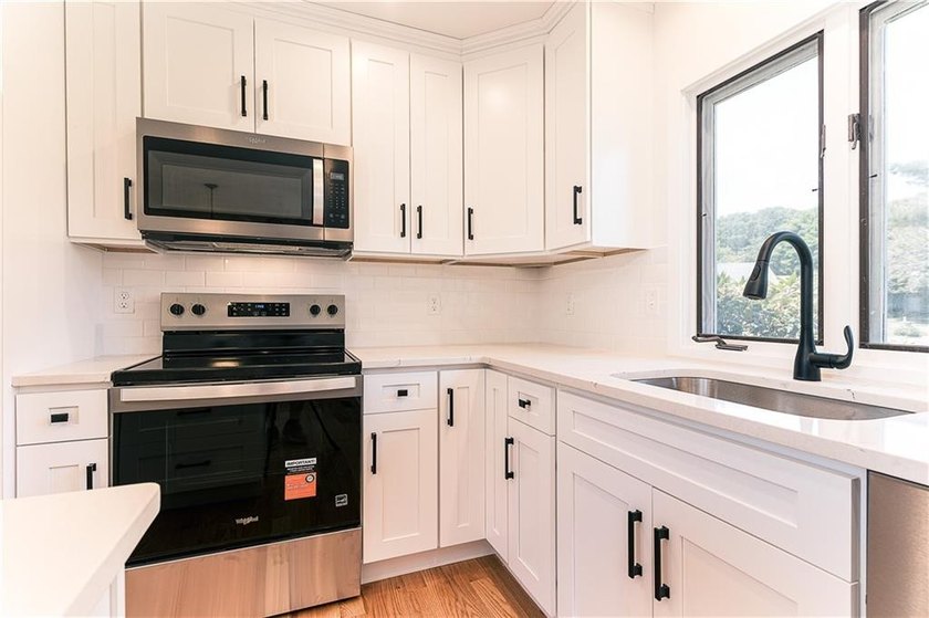 A rare find! Welcome to this sought-after one level end unit in - photo 8