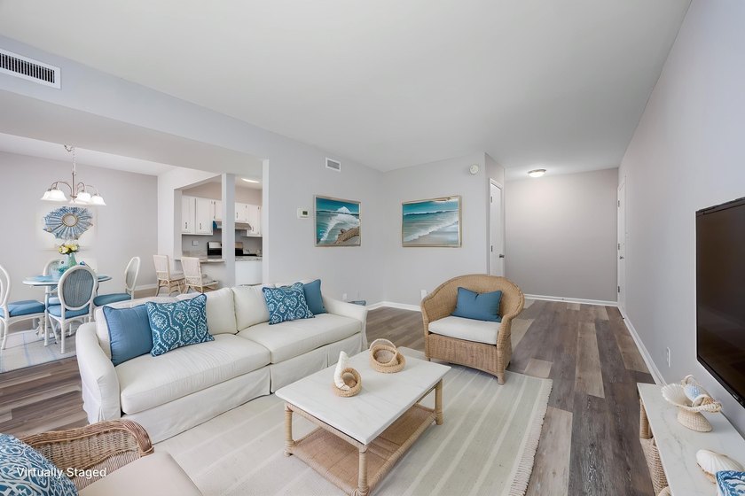 Discover easy coastal living in this beautifully renovated - photo 4