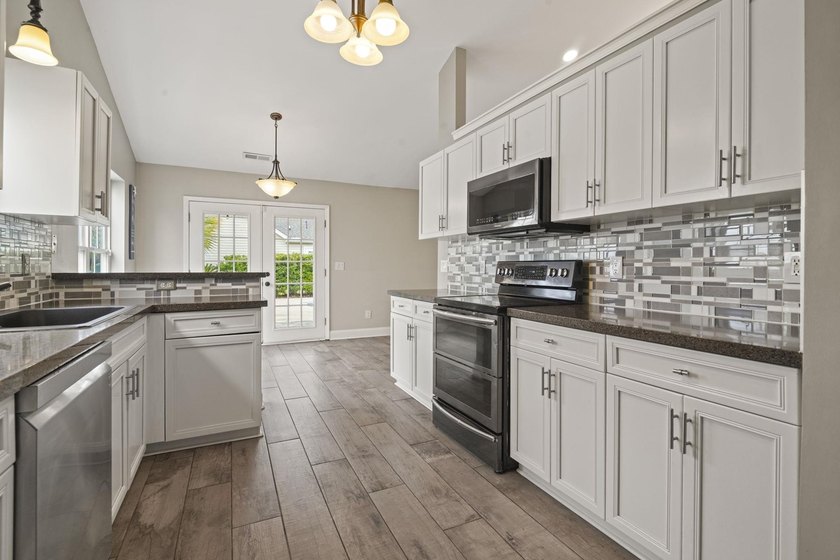 Welcome to 262 Palladium Drive, a beautifully maintained custom - photo 9