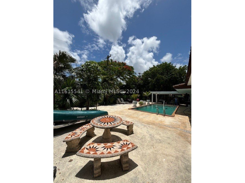 Tropical Oasis Near University of Miami! Step into this stunning - photo 3